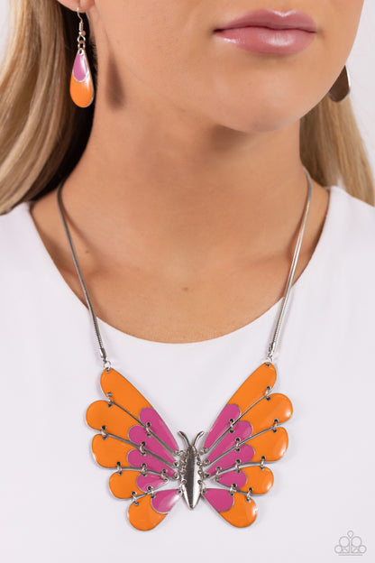 Moth Maven Pink Necklace - Paparazzi Accessories  Featuring hinged wings that gradually decrease in size, an oversized silver moth with Rose Violet and orange spots of color glides along a sleek silver chain for a whimsical statement. Features an adjustable clasp closure.  Sold as one individual necklace. Includes one pair of matching earrings.  P2ST-PKXX-157XX