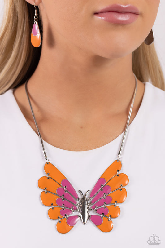 Moth Maven Pink Necklace - Paparazzi Accessories  Featuring hinged wings that gradually decrease in size, an oversized silver moth with Rose Violet and orange spots of color glides along a sleek silver chain for a whimsical statement. Features an adjustable clasp closure.  Sold as one individual necklace. Includes one pair of matching earrings.  P2ST-PKXX-157XX