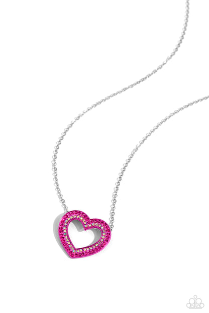 Hyper Heartland Pink Heart Necklace - Paparazzi Accessories  Two rows of glassy fuchsia and iridescent rhinestones are encrusted along the front of a Pink Peacock heart frame that glides along a dainty silver chain, creating a flirty centerpiece. Features an adjustable clasp closure. Due to its prismatic palette, color may vary.  Sold as one individual necklace. Includes one pair of matching earrings.  SKU: P2RE-PKXX-267XX