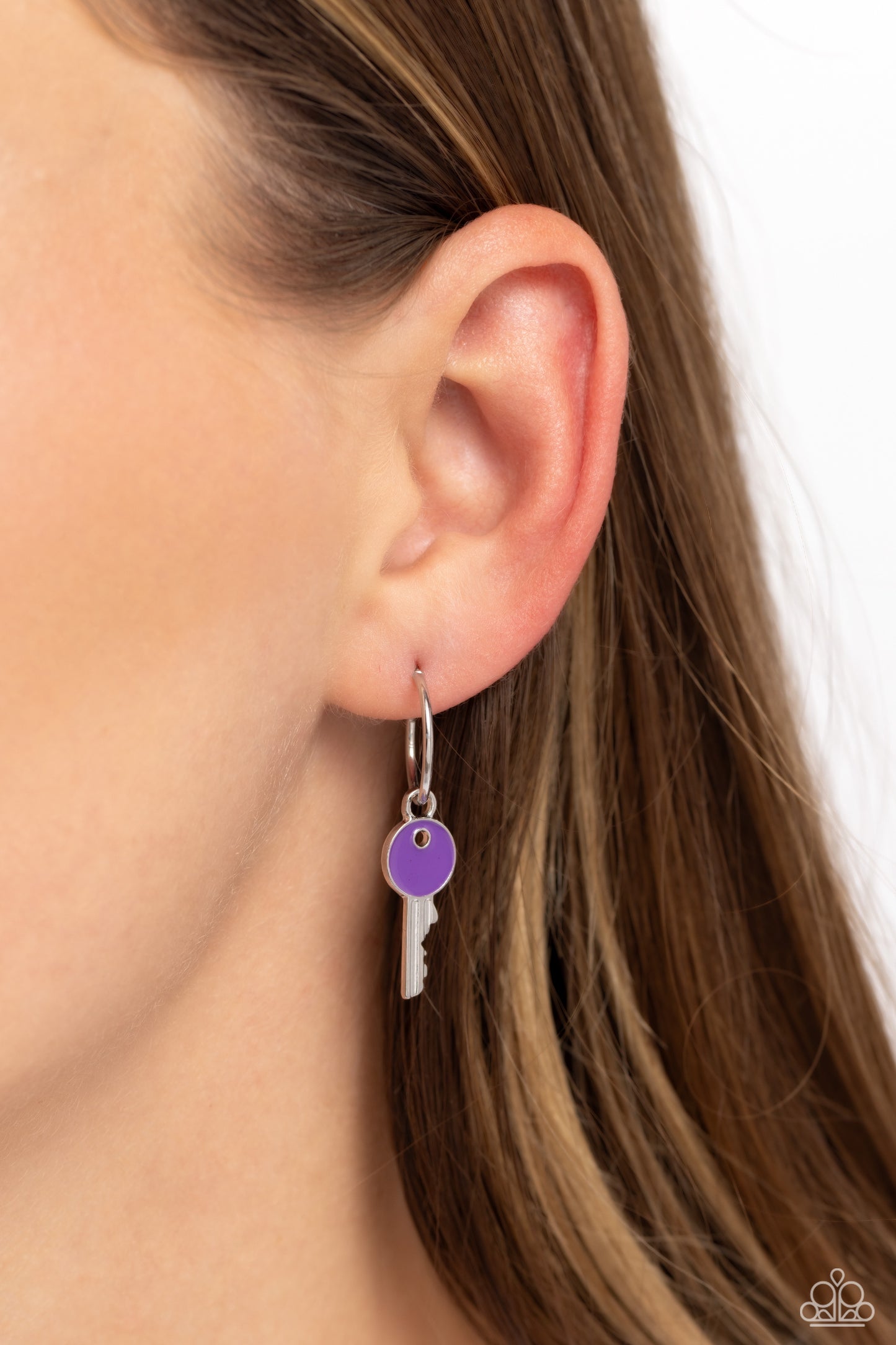 Key Performance Purple Tiny Hoop Earring - Paparazzi Accessories  A small, skinny, shiny silver hoop curves around the ear in a timeless fashion. A shiny silver ball is affixed to the end of the hoop, reminiscent of a barbell fitting. A silver key charm, featuring a bright purple-painted accent, slides along the curvature of the hoop, adding a surprising hint of colorful movement. Earring attaches to a standard post fitting. Hoop measures approximately 1/2" in diameter. P5HO-PRXX-026XX