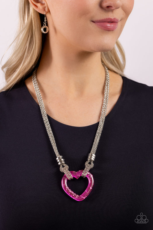 Lead with Your Heart Pink Necklace - Paparazzi Accessories  Featuring a double-layered display of silver popcorn chain, a silver-flecked pink acrylic heart frame cascades down the neckline. Infused atop the acrylic heart, a trio of high-sheen silver rings adorns the layered chains for an industrial finish. Features an adjustable clasp closure.  Sold as one individual necklace. Includes one pair of matching earrings.  P2SE-PKXX-257XX