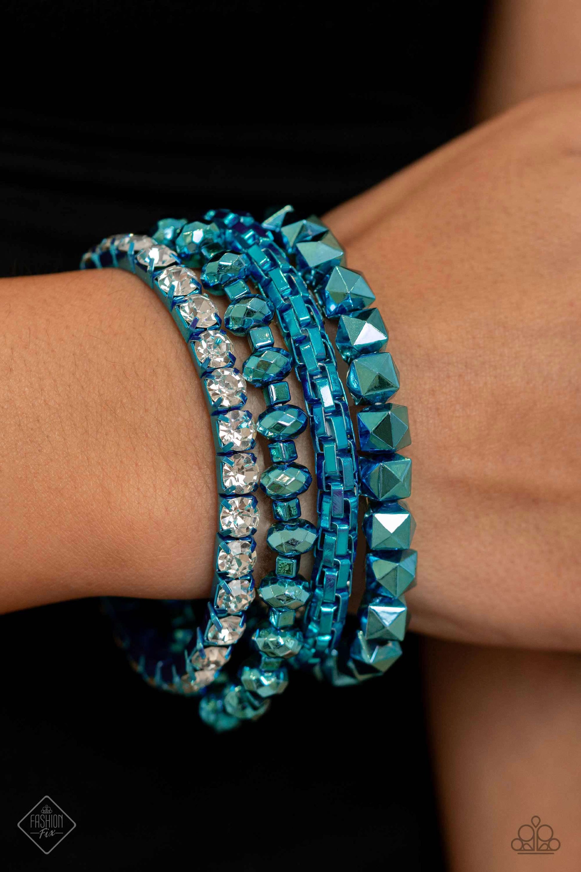 Punk Pattern Blue Stretch Bracelet - Paparazzi Accessories  Featuring a metallic blue hue, a collection of faceted beaded strands, a rounded box chain strand, and white rhinestones pressed in metallic blue fittings coalesce around the wrist for a punk-inspired stack.  Sold as one set of four bracelets.  Sku:  P9ED-BLXX-040SF