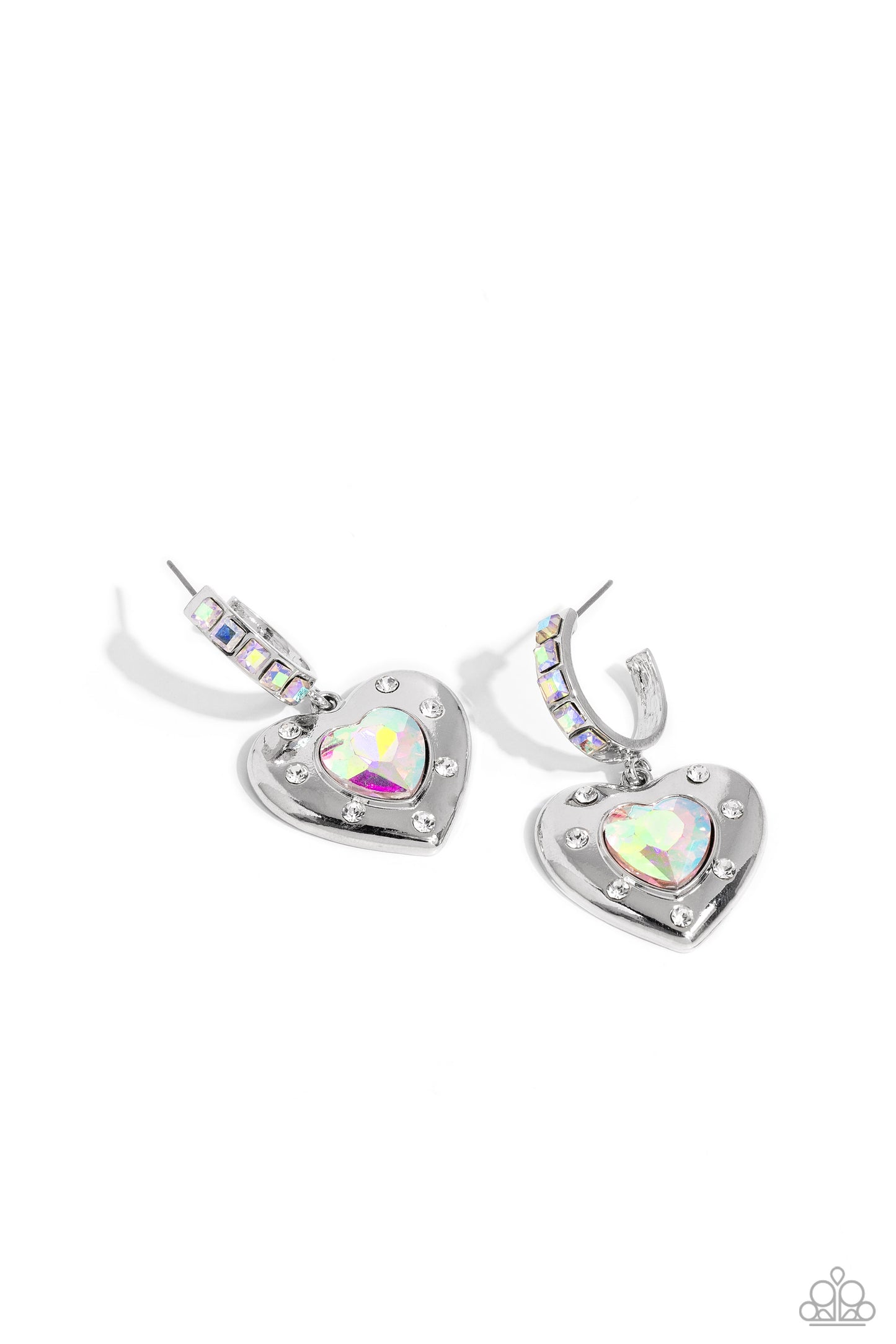 We Are Young White Heart Hoop Earring - Paparazzi Accessories  Featuring an iridescent shimmer, an iridescent heart gem is pressed into an antiqued silver heart frame adorned in white rhinestones. The antiqued heart sways from the bottom of a thick silver hoop encrusted in square iridescent gems resulting in a whimsical fashion. Earring attaches to a standard post fitting. Hoop measures approximately 3/4" in diameter. Due to its prismatic palette, color may vary.