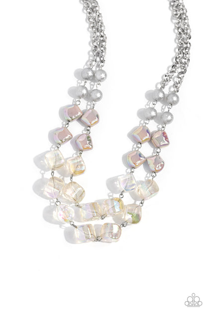 Eclectic Embellishment Silver Necklace - Paparazzi Accessories  Featuring a subtle scratch surface, a bubbly collection of silver pearls, abstract iridescent beads, and sparkly crystal-like iridescent beads are threaded along metallic rods that trickle in a two-layer display, creating an elegantly effervescent display below the collar. Features an adjustable clasp closure. Due to its prismatic palette, color may vary.  Sold as one individual necklace. Includes one pair of matching earrings.  P2ST-SVXX-212XX