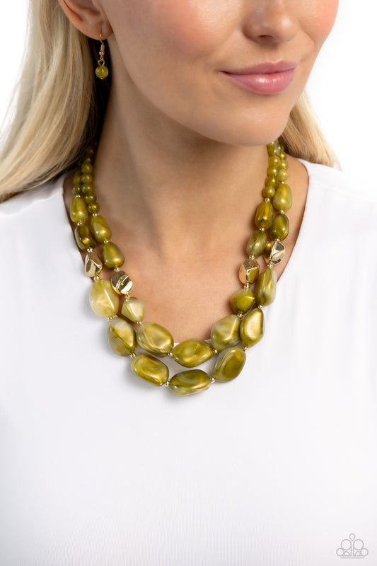 Seize the Statement Green Necklace - Paparazzi Accessories  Varying in shape and opacity, a refreshing collection of sparkle-infused green beads layer below the collar for a boldly colorful look. Accents of faceted gold beads and gold studs are infused throughout the design for a subtle touch of additional sheen. Features an adjustable clasp closure.  Sold as one individual necklace. Includes one pair of matching earrings.  New Kit Sku:  P2ST-GRXX-131XX