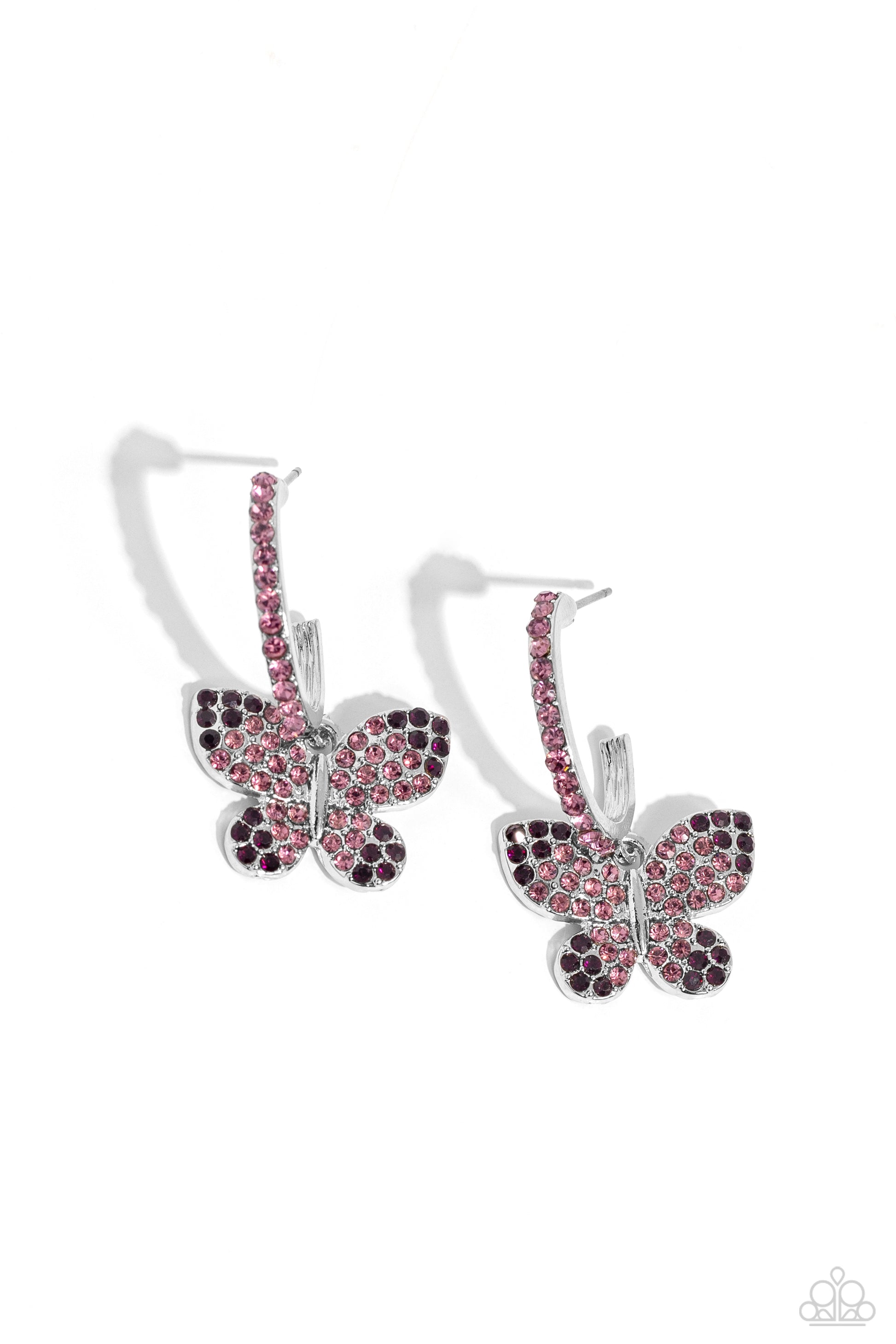 Whimsical Waltz Purple Butterfly Hoop Earring - Paparazzi Accessories  Adorning the wings of a silver butterfly, amethyst and light amethyst rhinestones shimmer and shine. The butterfly sways from the bottom of a thick silver C-shaped hoop encrusted in radiant-cut light amethyst rhinestones, resulting in a whimsical fashion. Earring attaches to a standard post fitting. Hoop measures approximately 3/4" in diameter.  Sold as one pair of hoop earrings.  Sku:  P5HO-PRXX-022XX
