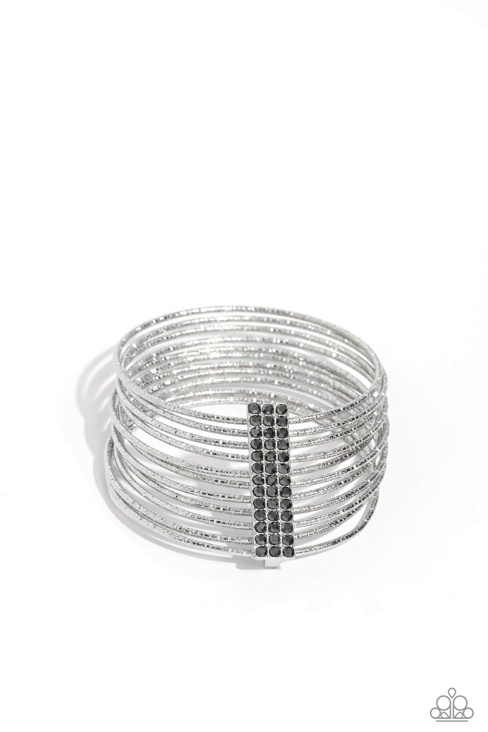 Shimmery Silhouette Silver Bangle Bracelet - Paparazzi Accessories  Held together by an elongated rectangular silver fitting and encrusted in three rows of hematite gems, silver bangles embossed in shimmery diamond-cut textures stack across the wrist for a refined display.  Featured inside The Preview at Made for More! Sold as one individual bracelet.  P9RE-SVXX-323XX