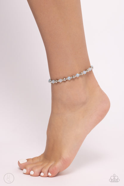 DEW or Die Blue Anklet - Paparazzi Accessories Infused with dainty silver accents, a collection of blue reflective beads are threaded along an invisible band around the ankle for a seasonal finish. Sold as one individual anklet. SKU: P9AN-BLXX-042XX