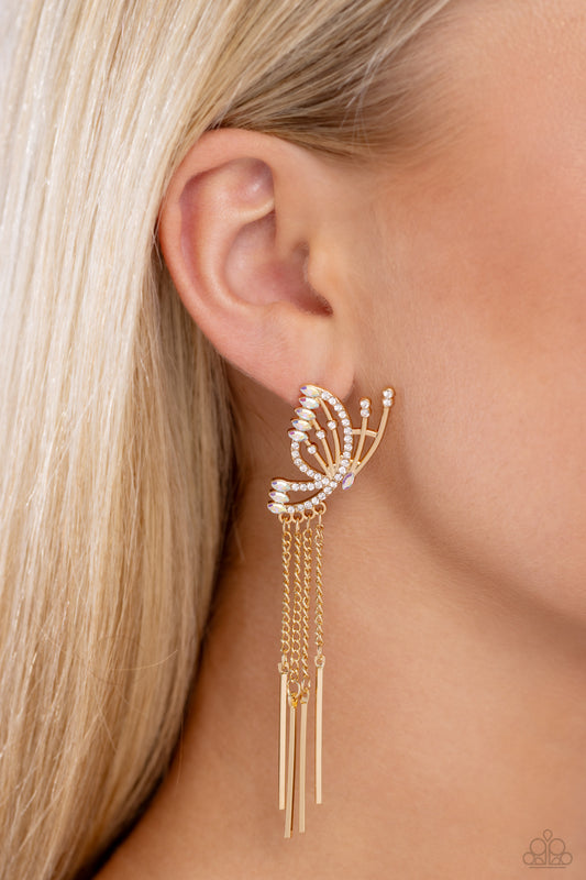 A Few Of My Favorite WINGS Gold Butterfly Post Earring - Paparazzi Accessories  Featuring dainty white rhinestones and dainty marquise-cut iridescent gems, a thin, elongated, airy gold butterfly is titled to the side as if about to take off in flight. A collection of dainty gold rods swings from dainty gold chain tassels at the bottom of the whimsical frame for some free-falling movement. Earring attaches to a standard post fitting. Due to its prismatic palette, color may vary.