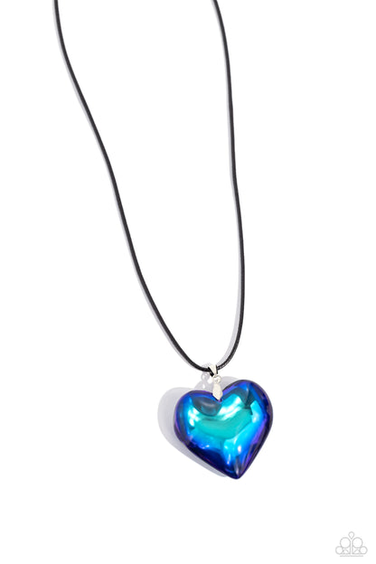 Seize the Simplicity Blue Heart Necklace - Paparazzi Accessories  Wrapped in a blue UV finish, an oversized heart pendant glides along a lengthened strand of black cord across the chest for a stellar flair. Features an adjustable clasp closure.  Sold as one individual necklace. Includes one pair of matching earrings.  Sku:  P2ST-BLXX-229XX