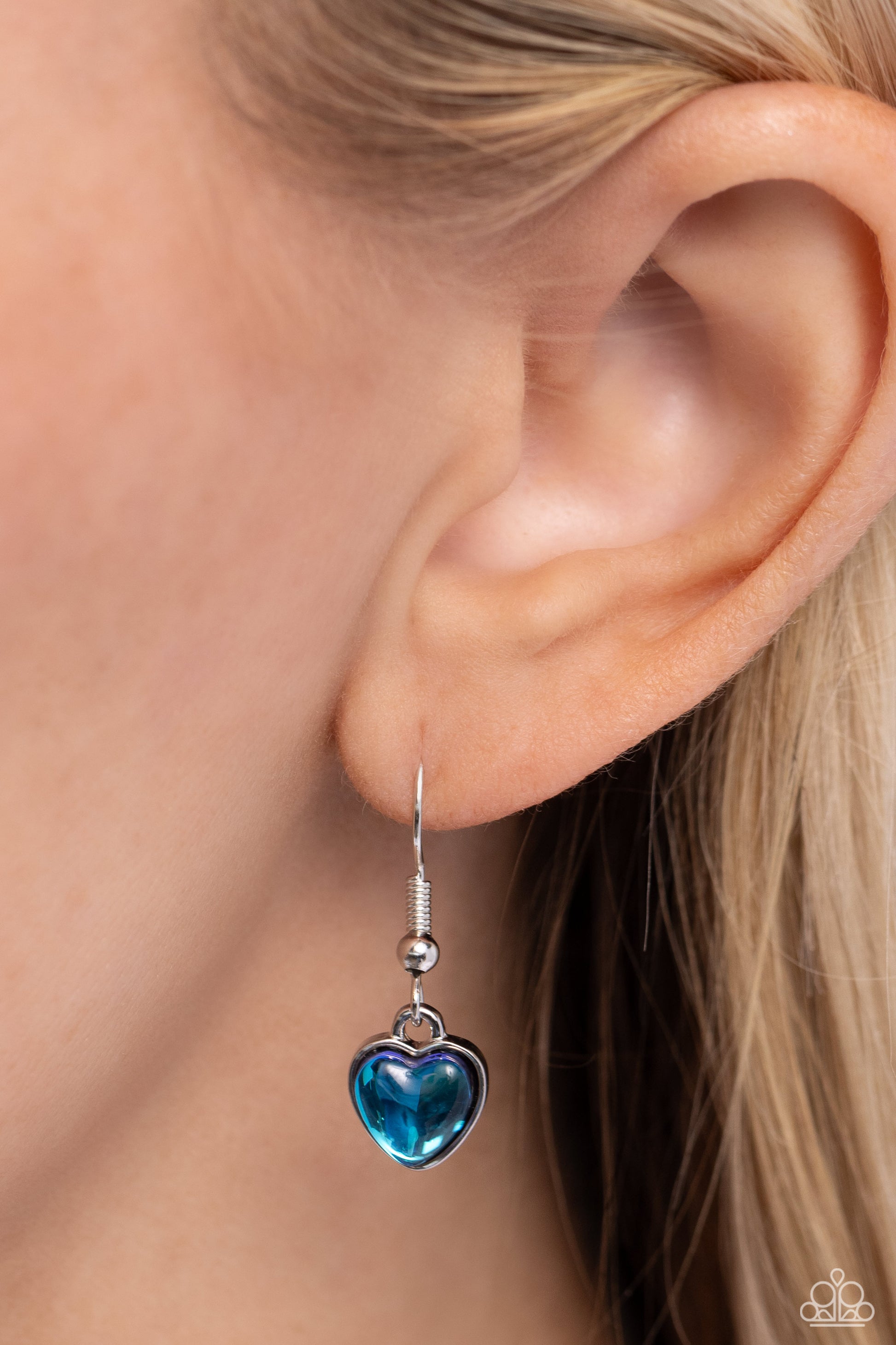 Seize the Simplicity Blue Heart Necklace - Paparazzi Accessories  Wrapped in a blue UV finish, an oversized heart pendant glides along a lengthened strand of black cord across the chest for a stellar flair. Features an adjustable clasp closure.  Sold as one individual necklace. Includes one pair of matching earrings.  Sku:  P2ST-BLXX-229XX