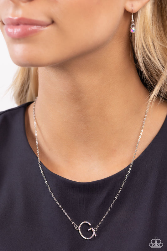 INITIALLY Yours Multi "G" Necklace - Paparazzi Accessories  Embossed with dainty iridescent rhinestones, a silver letter "G" hovers below the collar from a dainty silver chain, for a sentimentally simple design. Features an adjustable clasp closure. Due to its prismatic palette, color may vary.  Sold as one individual necklace. Includes one pair of matching earrings.  P2DA-MTXX-130XX