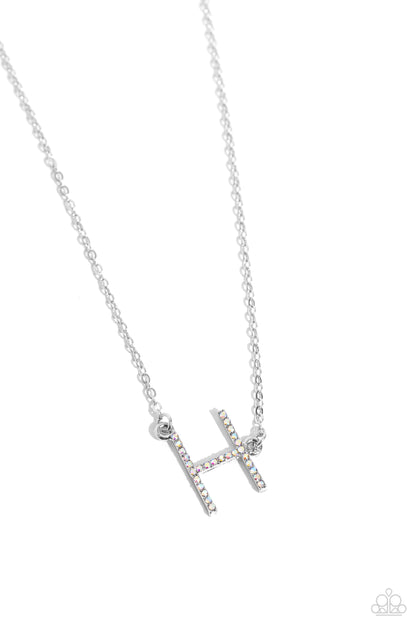 INITIALLY Yours Multi "H" Necklace - Paparazzi Accessories  Embossed with dainty iridescent rhinestones, a silver letter "H" hovers below the collar from a dainty silver chain, for a sentimentally simple design. Features an adjustable clasp closure. Due to its prismatic palette, color may vary.  Sold as one individual necklace. Includes one pair of matching earrings.  P2DA-MTXX-131XX