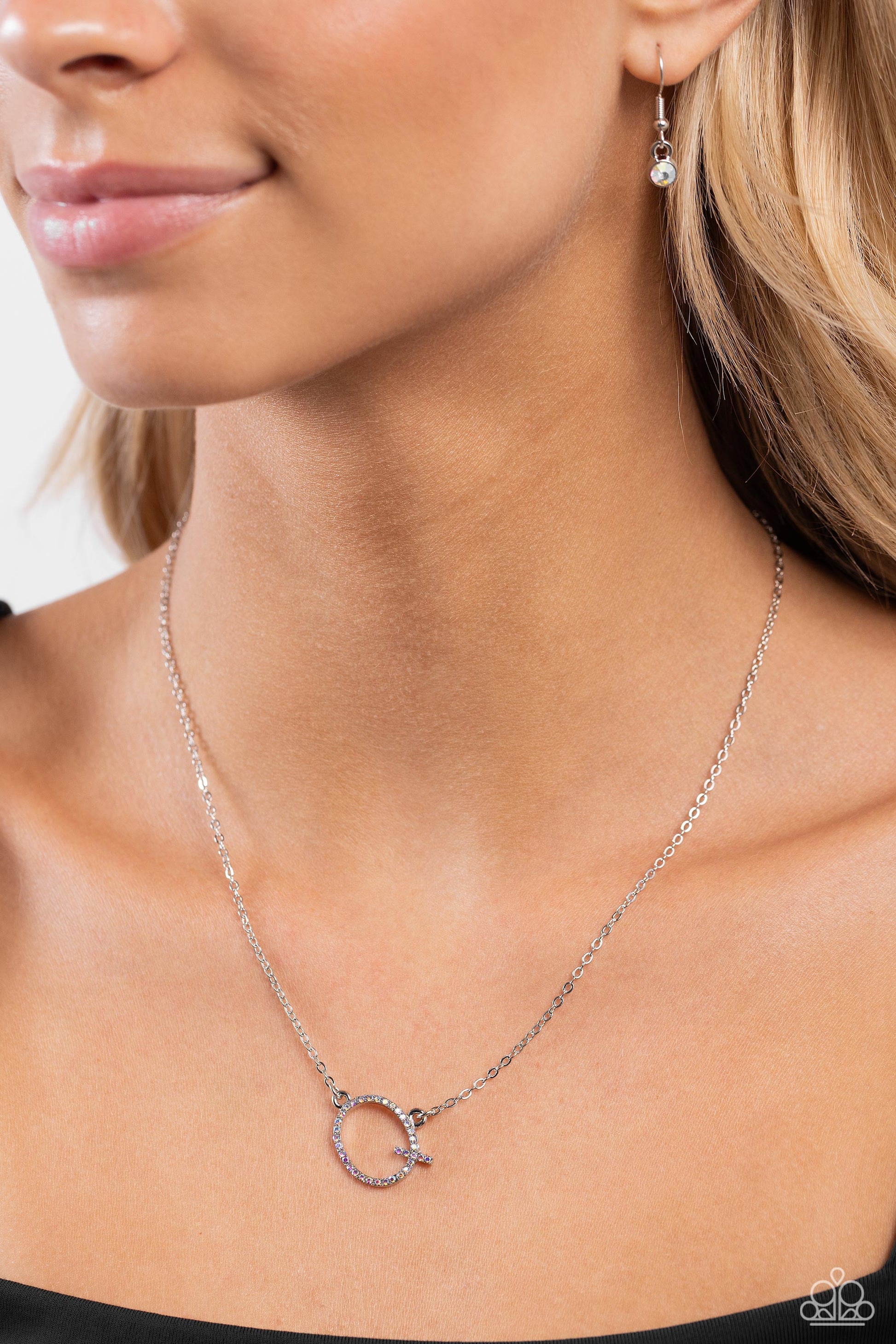 INITIALLY Yours Multi "Q" Necklace - Paparazzi Accessories  Embossed with dainty iridescent rhinestones, a silver letter "Q" hovers below the collar from a dainty silver chain, for a sentimentally simple design. Features an adjustable clasp closure. Due to its prismatic palette, color may vary.  Sold as one individual necklace. Includes one pair of matching earrings.