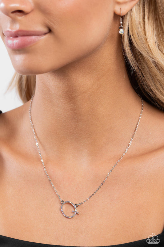 INITIALLY Yours Multi "Q" Necklace - Paparazzi Accessories  Embossed with dainty iridescent rhinestones, a silver letter "Q" hovers below the collar from a dainty silver chain, for a sentimentally simple design. Features an adjustable clasp closure. Due to its prismatic palette, color may vary.  Sold as one individual necklace. Includes one pair of matching earrings.