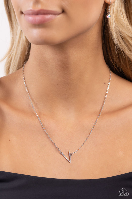 INITIALLY Yours Multi "V" Necklace - Paparazzi Accessories  Embossed with dainty iridescent rhinestones, a silver letter "V" hovers below the collar from a dainty silver chain, for a sentimentally simple design. Features an adjustable clasp closure. Due to its prismatic palette, color may vary.  Sold as one individual necklace. Includes one pair of matching earrings.  P2DA-MTXX-145XX