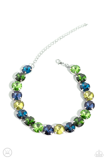 Alluring A-Lister Green Rhinestone Choker Necklace - Paparazzi Accessories  Featuring various shades of green and blue, a collection of faceted gems in pronged silver fittings come to a point as they coalesce around the collar for a dramatically refined display. Features an adjustable clasp closure.  Sold as one individual choker necklace. Includes one pair of matching earrings.  Sku:  P2CH-GRXX-031XX