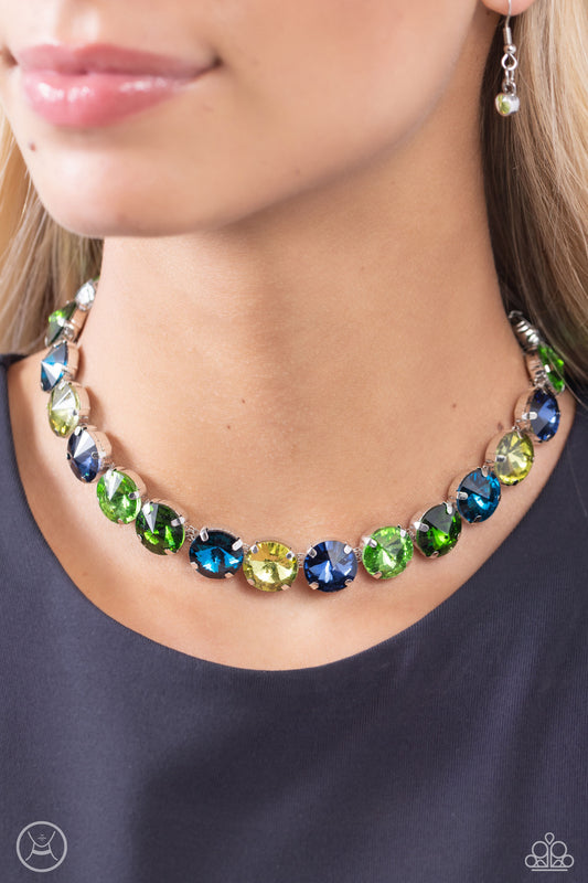 Alluring A-Lister Green Rhinestone Choker Necklace - Paparazzi Accessories  Featuring various shades of green and blue, a collection of faceted gems in pronged silver fittings come to a point as they coalesce around the collar for a dramatically refined display. Features an adjustable clasp closure.  Sold as one individual choker necklace. Includes one pair of matching earrings.  Sku:  P2CH-GRXX-031XX