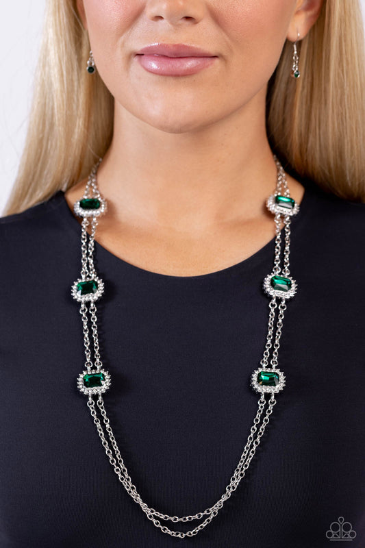 Pocketful of Sunshine Green Rhinestone Necklace - Paparazzi Accessories  Pressed in sunburst-like, rhinestone-encrusted pronged silver fittings, a collection of emerald-cut green gems are infused between a double-strand of silver chains for a standout statement. Features an adjustable clasp closure.  Sold as one individual necklace. Includes one pair of matching earrings.  Sku:  P2RE-GRXX-285XX