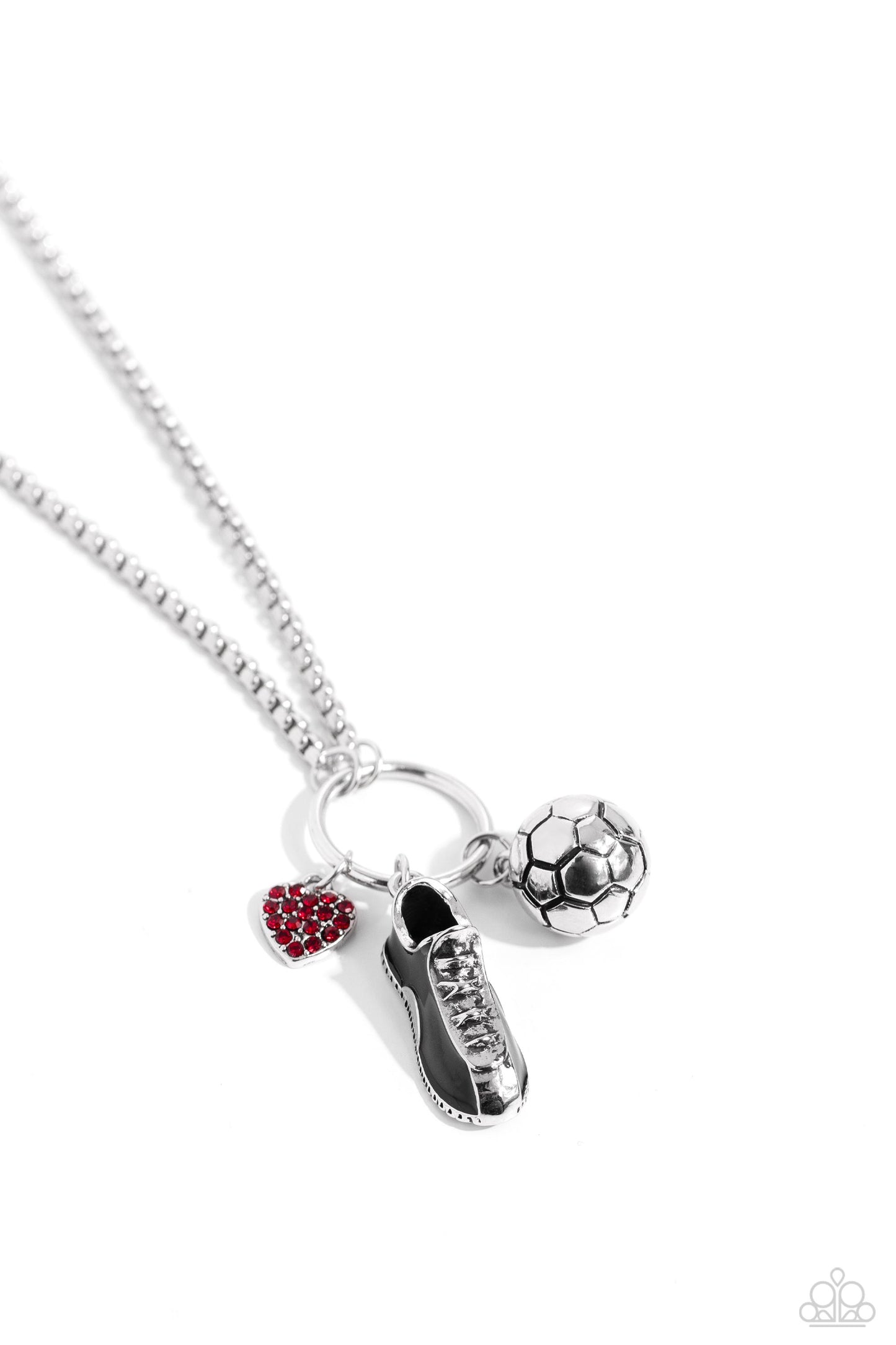 Corner Kick Red Necklace - Paparazzi Accessories  Dangling from a silver hoop attached to silver popcorn chains, three soccer-inspired charms, including a silver soccer ball, black-painted cleat, and red rhinestone-encrusted heart, swing for a sporty finish. Features an adjustable clasp closure.  Sold as one individual necklace. Includes one pair of matching earrings.  P2WH-RDXX-341XX