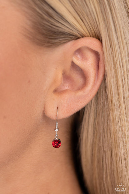 Corner Kick Red Necklace - Paparazzi Accessories  Dangling from a silver hoop attached to silver popcorn chains, three soccer-inspired charms, including a silver soccer ball, black-painted cleat, and red rhinestone-encrusted heart, swing for a sporty finish. Features an adjustable clasp closure.  Sold as one individual necklace. Includes one pair of matching earrings.  P2WH-RDXX-341XX