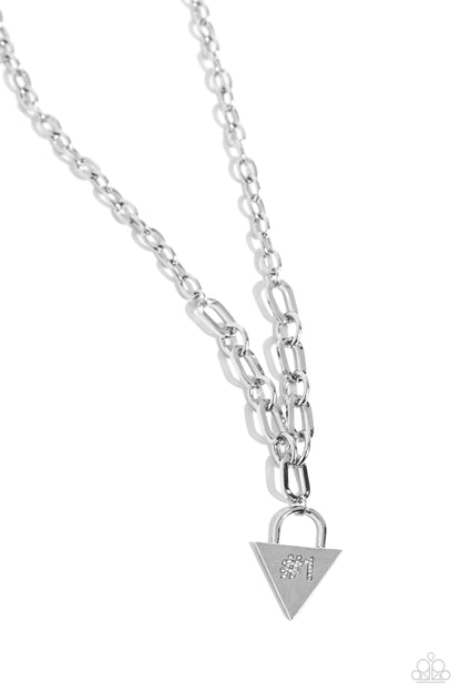 Your Number One Follower White Necklace - Paparazzi Accessories  Dangling from a collection of oversized, curved links connected to a silver link chain, a locket-inspired pendant rests in the shape of a triangle. Embossed in white rhinestones, a #1 gleams from the center of the pendant for a sports-inspired finish. Features an adjustable clasp closure.  Sold as one individual necklace. Includes one pair of matching earrings.  P2DA-WTXX-238XX