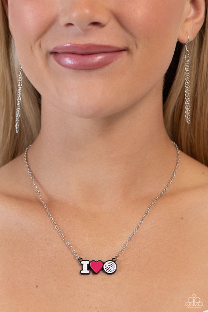 Meet Me at the Net Pink Necklace - Paparazzi Accessories  Cascading from a dainty silver chain, a white-painted "I," a pink heart, and a white volleyball charm lay beside one another in black-painted frames for a sports-inspired display. Features an adjustable clasp closure.  Sold as one individual necklace. Includes one pair of matching earrings.  P2DA-PKXX-200XX