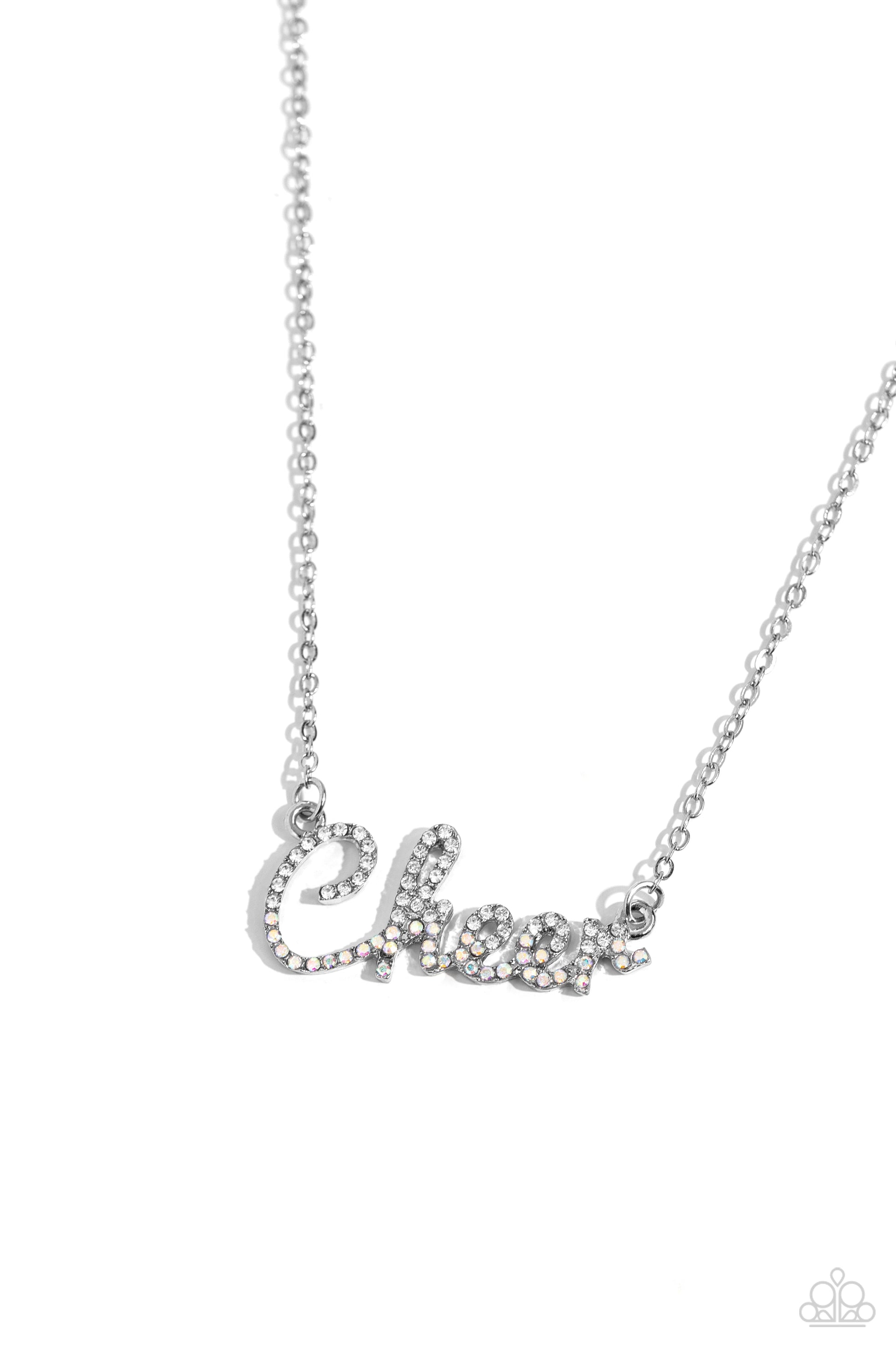 Cheer Squad White Necklace - Paparazzi Accessories  Curled in a script font, glistening silver letters spell out the word "Cheer" along a dainty silver chain. Embossed on the letters, dainty white rhinestones and iridescent rhinestones create a subtle ombré effect for a peppy finish. Features an adjustable clasp closure. Due to its prismatic palette, color may vary.  Sold as one individual necklace. Includes one pair of matching earrings.  P2WD-WTXX-276XX