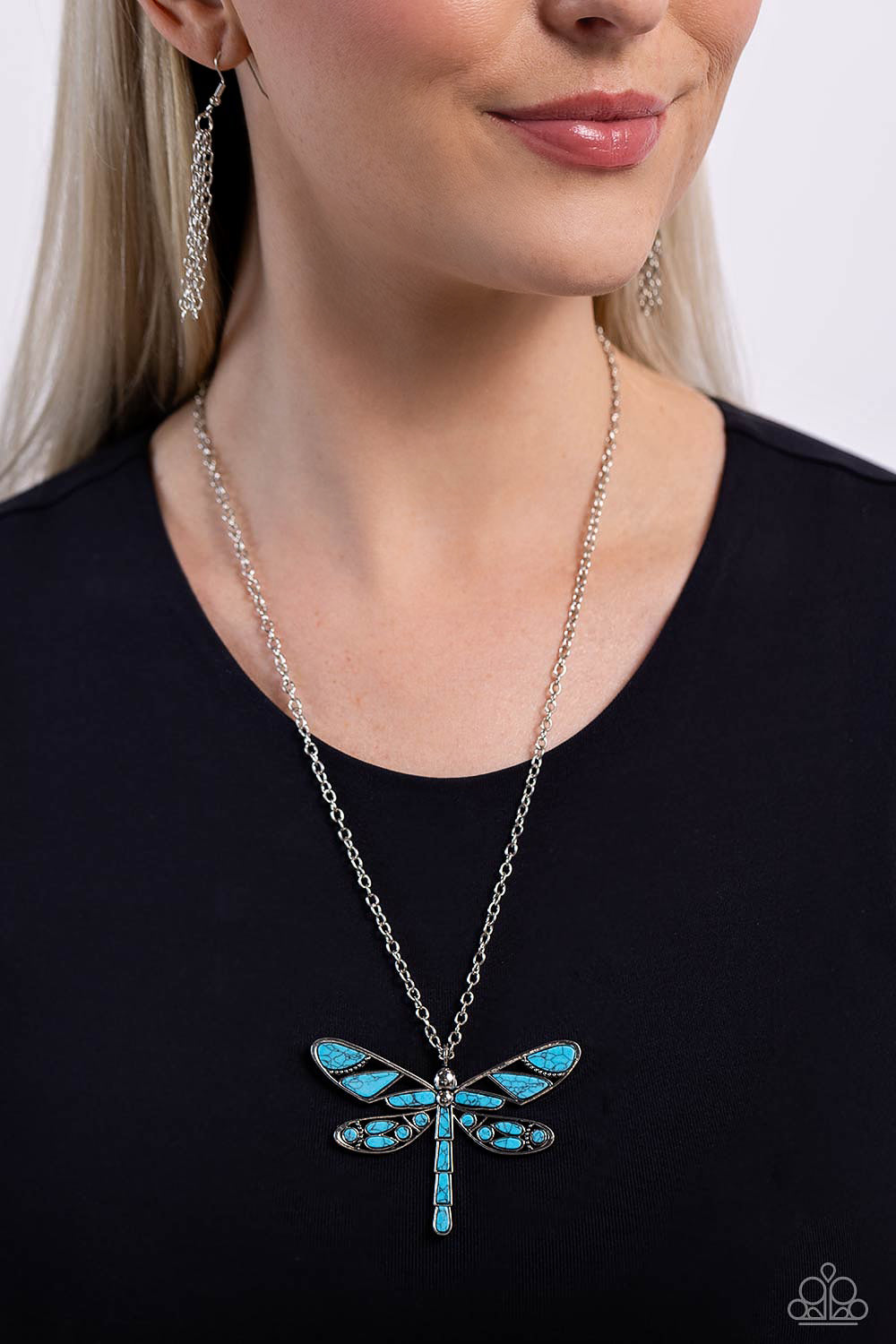 FLYING Low Turquoise Dragonfly Necklace - Paparazzi Accessories  Featuring a classic silver chain, various cuts of turquoise stone are passed into an oversized, airy silver dragonfly pendant for a rustically earthy centerpiece. Features an adjustable clasp closure. As the stone elements in this piece are natural, some color variation is normal.  Sold as one individual necklace. Includes one pair of matching earrings.  Sku:  P2SE-BLXX-548XX