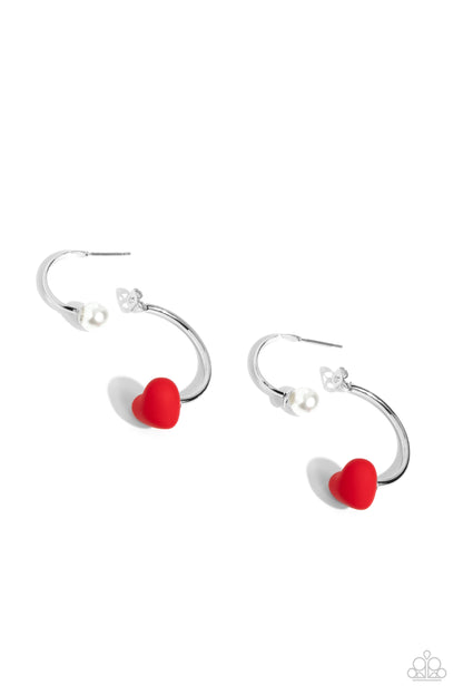 Romantic Representative Red Heart Jacket Earring - Paparazzi Accessories  A solitaire white pearl attaches to a double-sided post, designed to fasten behind the ear. Dotted with a red acrylic heart, the double-sided post peeks out beneath the ear for a romantic look. Earring attaches to a standard post fitting. Hoop measures approximately 1" in diameter.  Sold as one pair of double-sided hoop earrings.  SKU: P5HO-RDXX-030XX