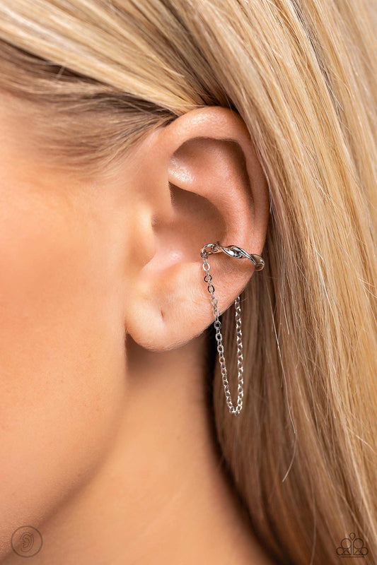 CUFF Hanger Silver Ear Cuff - Paparazzi Accessories  A glistening silver bar delicately twists into a dainty hoop while a solitaire shimmery silver chain cascades below it, creating an adjustable refined, one-size-fits-all display.  Sold as one pair of cuff earrings.  Sku:  P5PO-CFSV-257XX