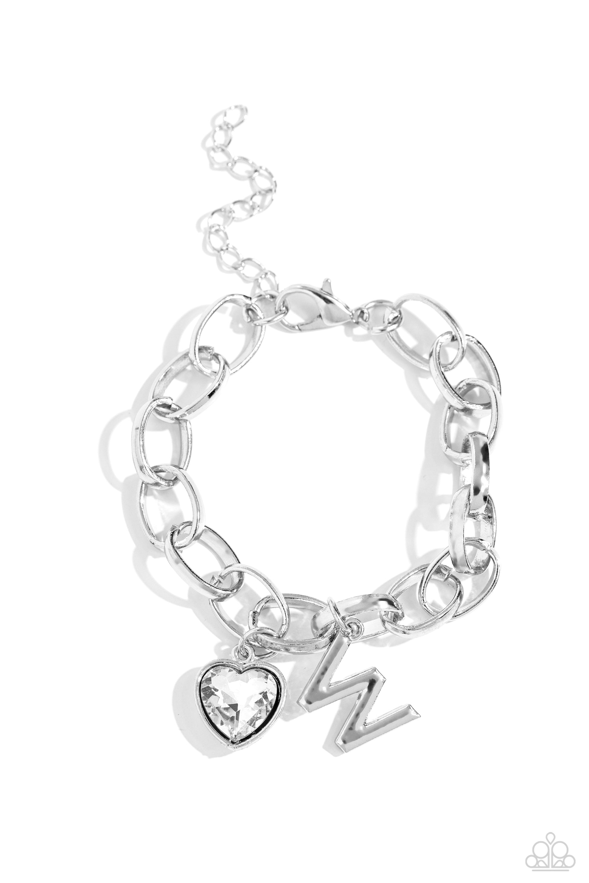 Guess Now Its INITIAL White "W" Bracelet - Paparazzi Accessories  A simple collection of silver charms — including a white rhinestone heart pressed in a silver frame and a sleek letter "W" — dance from a chunky silver chain around the wrist, creating a sentimental fringe. Features an adjustable clasp closure.  Sold as one individual bracelet.  New Kit Sku:  P9BA-WTXX-057XX