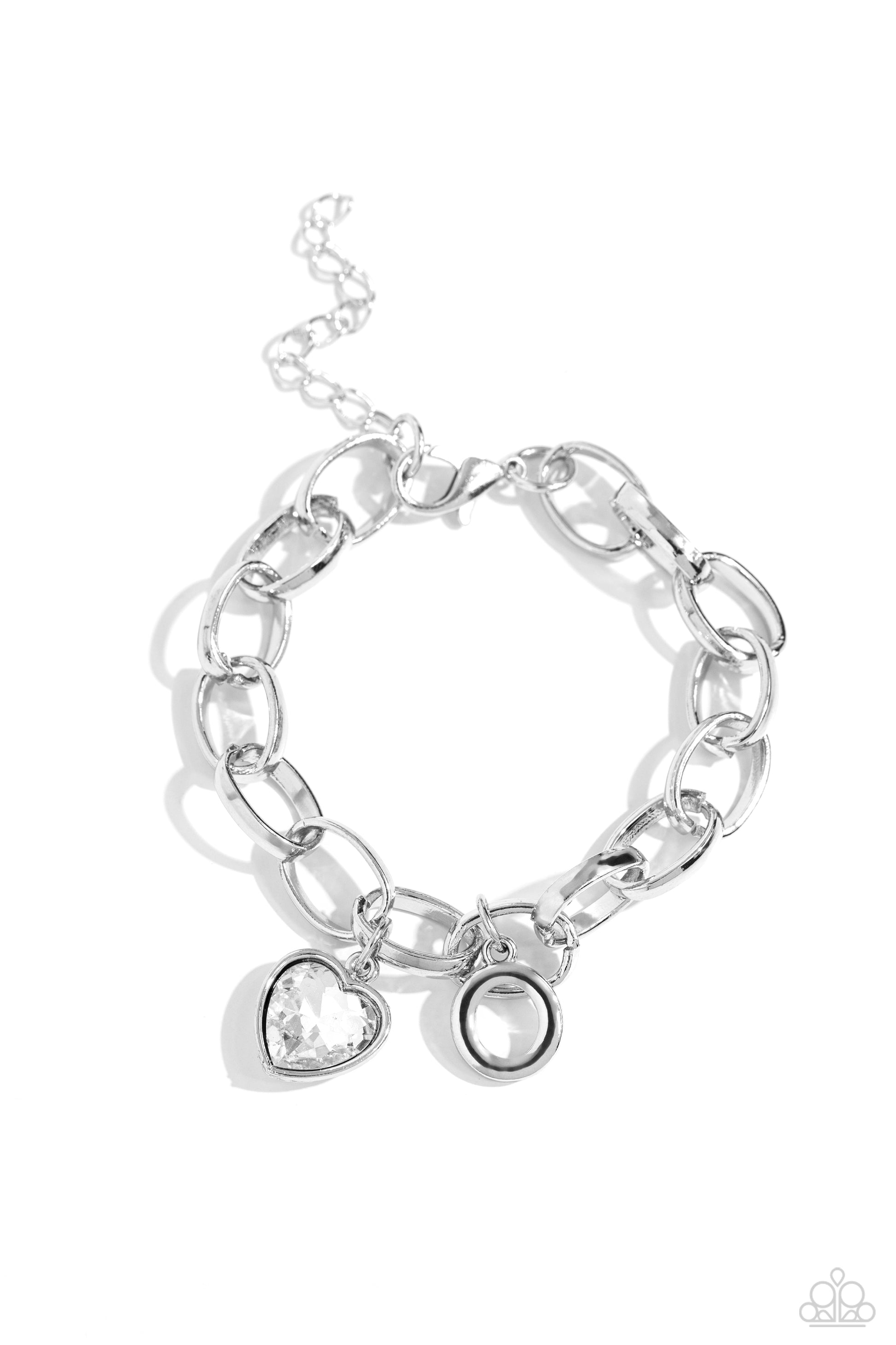 Guess Now Its INITIAL White "O" Bracelet - Paparazzi Accessories  A simple collection of silver charms — including a white rhinestone heart pressed in a silver frame and a sleek letter "O" — dance from a chunky silver chain around the wrist, creating a sentimental fringe. Features an adjustable clasp closure.  Sold as one individual bracelet.  New Kit Sku:  P9BA-WTXX-049XX