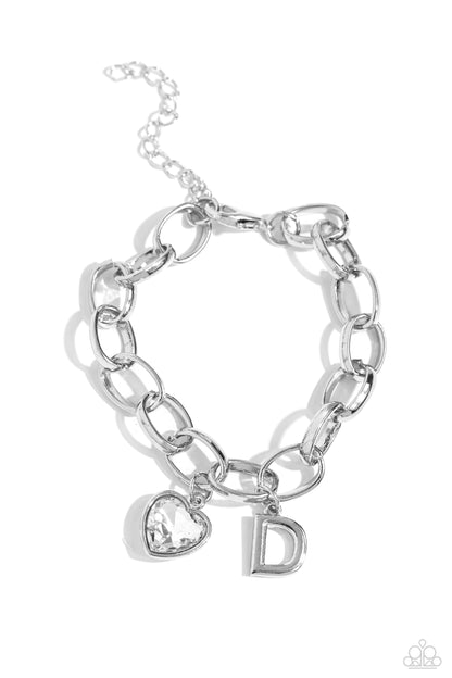 Guess Now Its INITIAL White "D" Bracelet - Paparazzi Accessories  A simple collection of silver charms — including a white rhinestone heart pressed in a silver frame and a sleek letter "D" — dance from a chunky silver chain around the wrist, creating a sentimental fringe. Features an adjustable clasp closure.  Sold as one individual bracelet.  New Kit Sku:  P9BA-WTXX-038XX