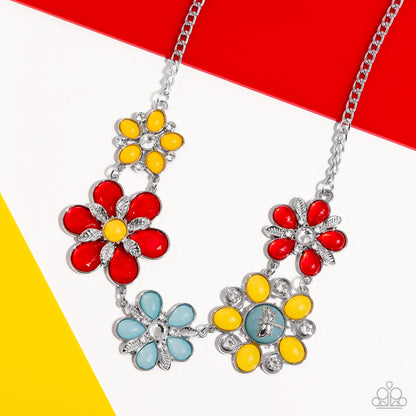 Dragonfly Decadence Red Necklace - Paparazzi Accessories Dotted with white rhinestone and yellow and turquoise beaded centers, a flirtatious assortment of red, yellow, and turquoise flowers link below the collar for a playful pop of color. Textured silver leaves and rhinestone-embellished swirls bloom amongst the petals and from the shimmery centers for additional eye-catching texture. A dainty silver dragonfly charm perches atop one of the flowers for a free-spirited finish. SKU:P2ST-RDXX-130XX