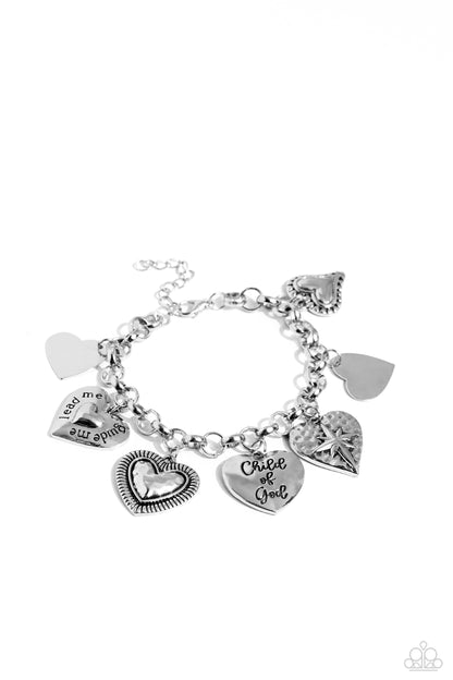 Child of God Silver Inspirational Bracelet - Paparazzi Accessories  A whimsical collection of silver heart charms — featuring hammered, diamond-cut, and smooth textures — dance from a silver chain around the wrist, creating a boisterous fringe. Two of the hearts feature the phrases "Child of God" and "'Lead Me, Guide Me" for a religious-inspired finish. Features an adjustable clasp closure.  Sold as one individual bracelet.  Sku:  P9WD-SVXX-237XX