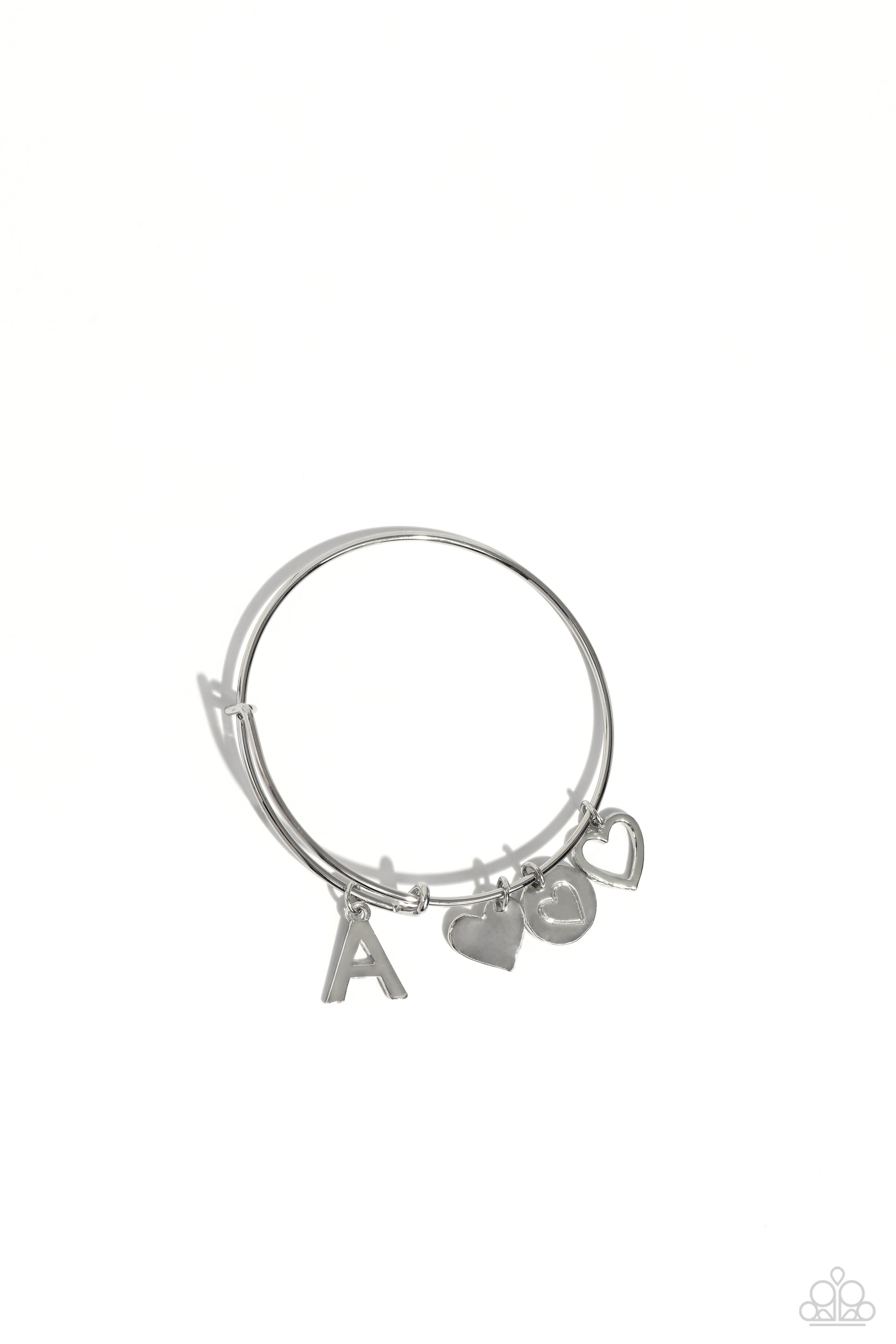 Making It INITIAL Silver "A" Bracelet - Paparazzi Accessories  Featuring shiny silver, airy, and stamped finishes, a mismatched collection of dainty heart charms, and the letter "A" glides along a silver bar fitting at the center of the wrist for a romantic, sentimental flair.  Sold as one individual bracelet.  SKU: P9BA-SVXX-185XX