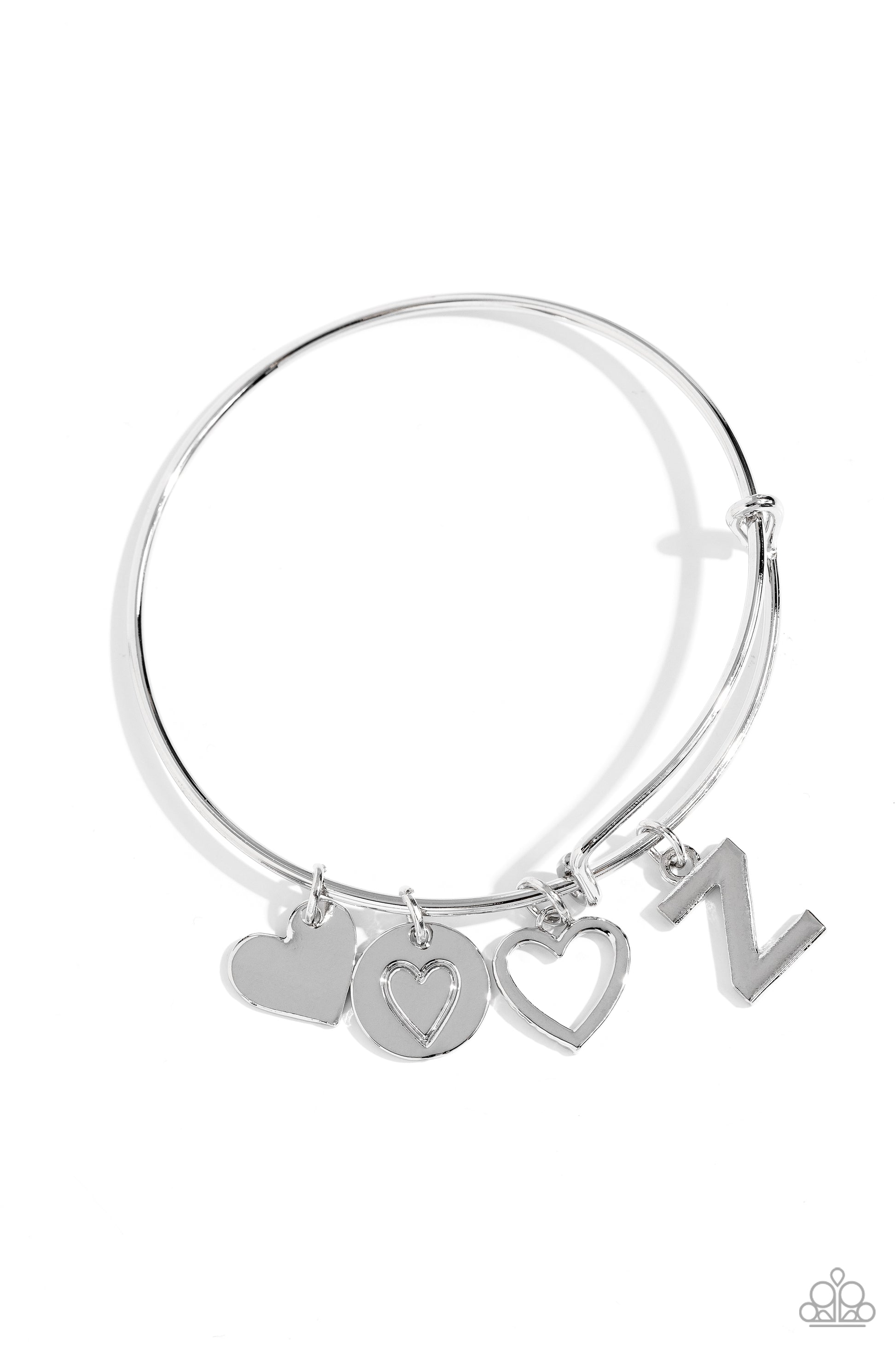 Making It INITIAL Silver "Z" Bangle Bracelet - Paparazzi Accessories  Featuring shiny silver, airy, and stamped finishes, a mismatched collection of dainty heart charms, and the letter "Z" glides along a silver bar fitting at the center of the wrist for a romantic, sentimental flair.  Sold as one individual bracelet.  SKU: P9BA-SVXX-210XX