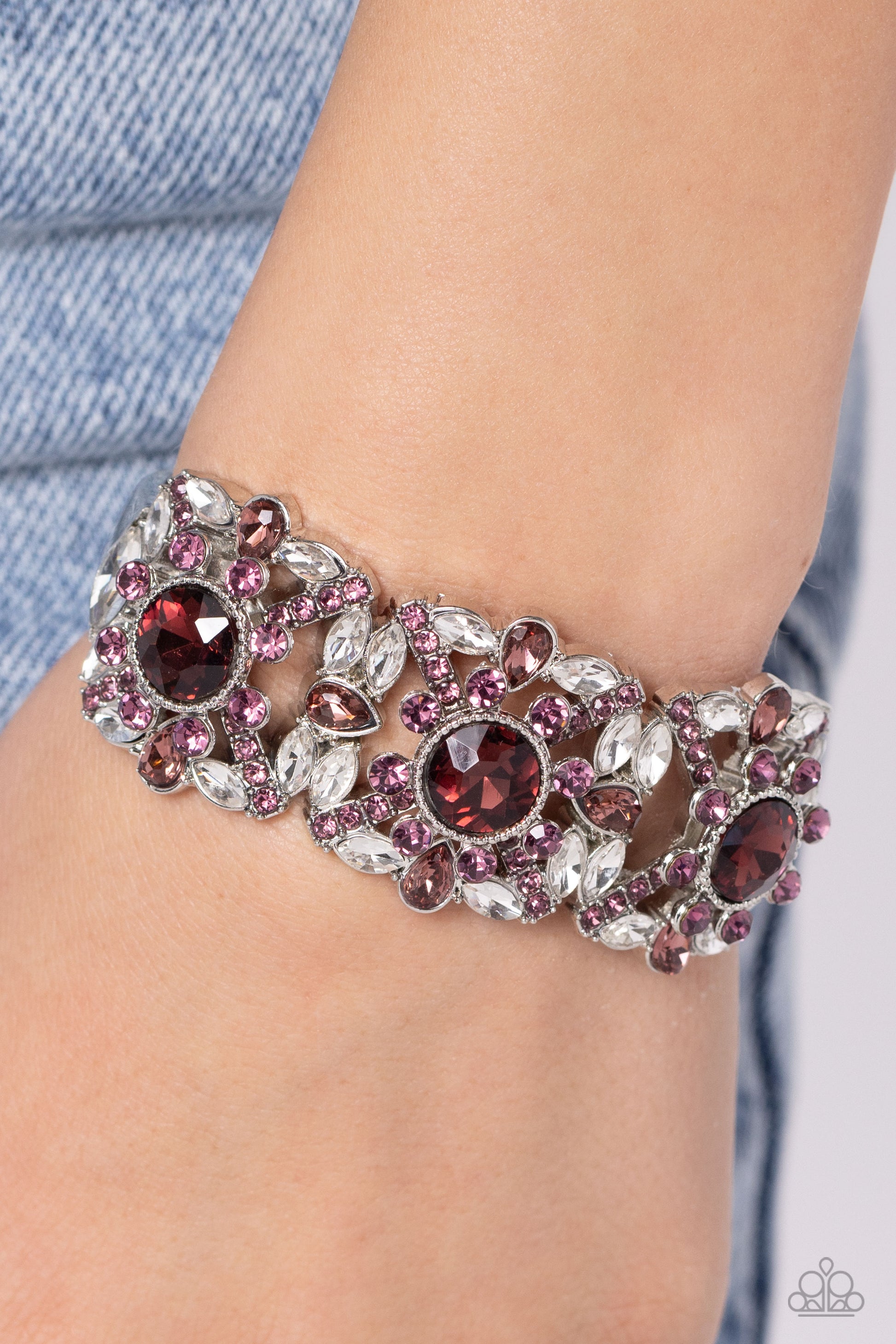Shimmering Solo Purple Hinge Bracelet - Paparazzi Accessories  Various purple and white rhinestones in round, teardrop, and marquise cuts sparkle atop airy, silver frames, connected to a silver bangle-like bracelet around the wrist for a jaw-dropping dazzle. Features a hinged closure.  Sold as one individual bracelet.  SKU: P9RE-PRXX-176XX
