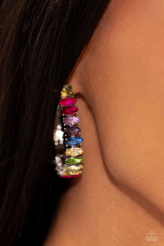 Rainbow Range Multi Hoop Earring - Paparazzi Accessories  Dazzling colorful marquise-cut gems fall in line along the front edge of a classic silver hoop. The exposed edges create a gritty silhouette, beautifully contrasting with the blinding shimmer of the gems in a stunning finish. Earring attaches to a standard post fitting. Hoop measures approximately 1 1/2" in diameter.  Sold as one pair of hoop earrings.  P5HO-MTXX-080XX