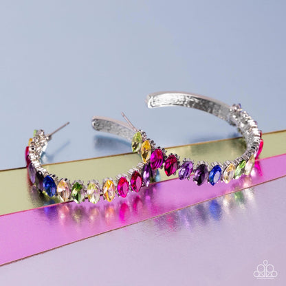 Rainbow Range Multi Hoop Earring - Paparazzi Accessories  Dazzling colorful marquise-cut gems fall in line along the front edge of a classic silver hoop. The exposed edges create a gritty silhouette, beautifully contrasting with the blinding shimmer of the gems in a stunning finish. Earring attaches to a standard post fitting. Hoop measures approximately 1 1/2" in diameter.  Sold as one pair of hoop earrings.  P5HO-MTXX-080XX
