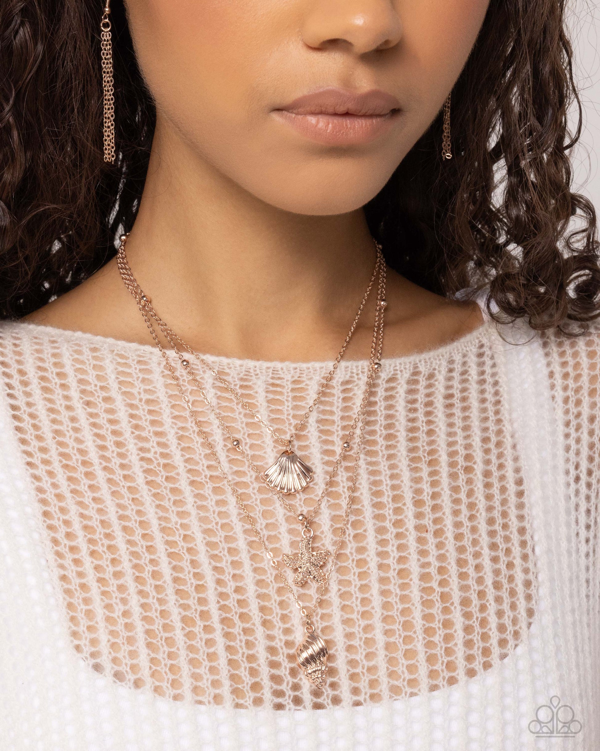 Seashell Sonata Rose Gold Necklace - Paparazzi Accessories A mismatched collection of dainty rose gold and satellite rose gold chains loop and layer below the neckline. Dangling along each layer, textured rose gold seashells and a starfish create a coastal centerpiece. Features an adjustable clasp closure. Sold as one individual necklace. Includes one pair of matching earrings. SKU: P2SE-GDRS-133WO Earring: "SHELL, I Was In the Area - Rose Gold" (Sold Separately)