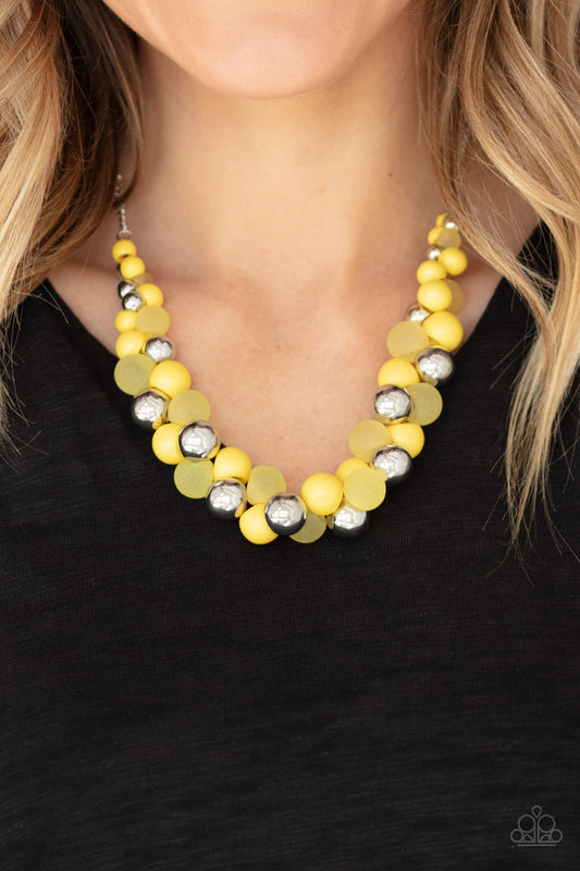 Bubbly Brilliance - Yellow Item #N737 A bubbly collection of imperfect silver, opaque, and yellow beads are threaded along an invisible wire below the collar, creating a colorful cluster. Features an adjustable clasp closure. All Paparazzi Accessories are lead free and nickel free!  Sold as one individual necklace. Includes one pair of matching earrings.