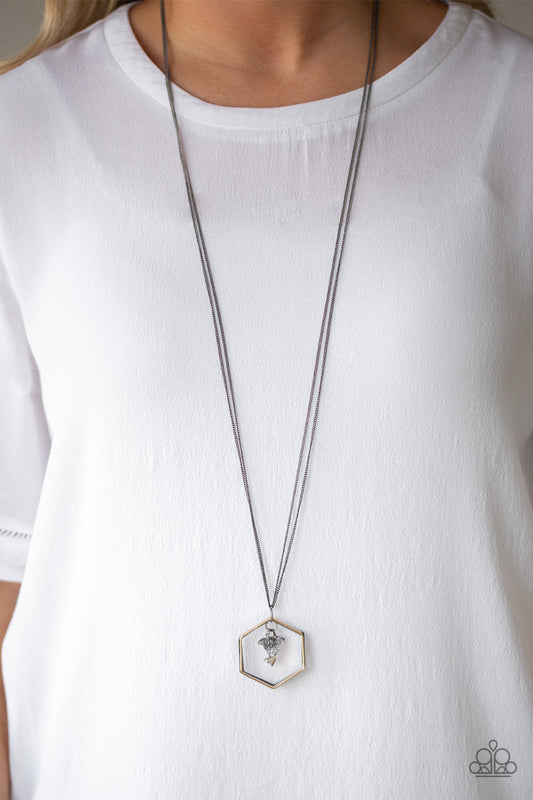 Chicly Geocentric - Multi Item #N653 A trio of gold, gunmetal, and silver hexagonal frames swing from the bottom of a doubled gunmetal chain. A cluster of metallic-flecked crystal-like beads swings from the top of the layered pendant for an edgy finish. Features an adjustable clasp closure. All Paparazzi Accessories are lead free and nickel free!  Sold as one individual necklace. Includes one pair of matching earrings.