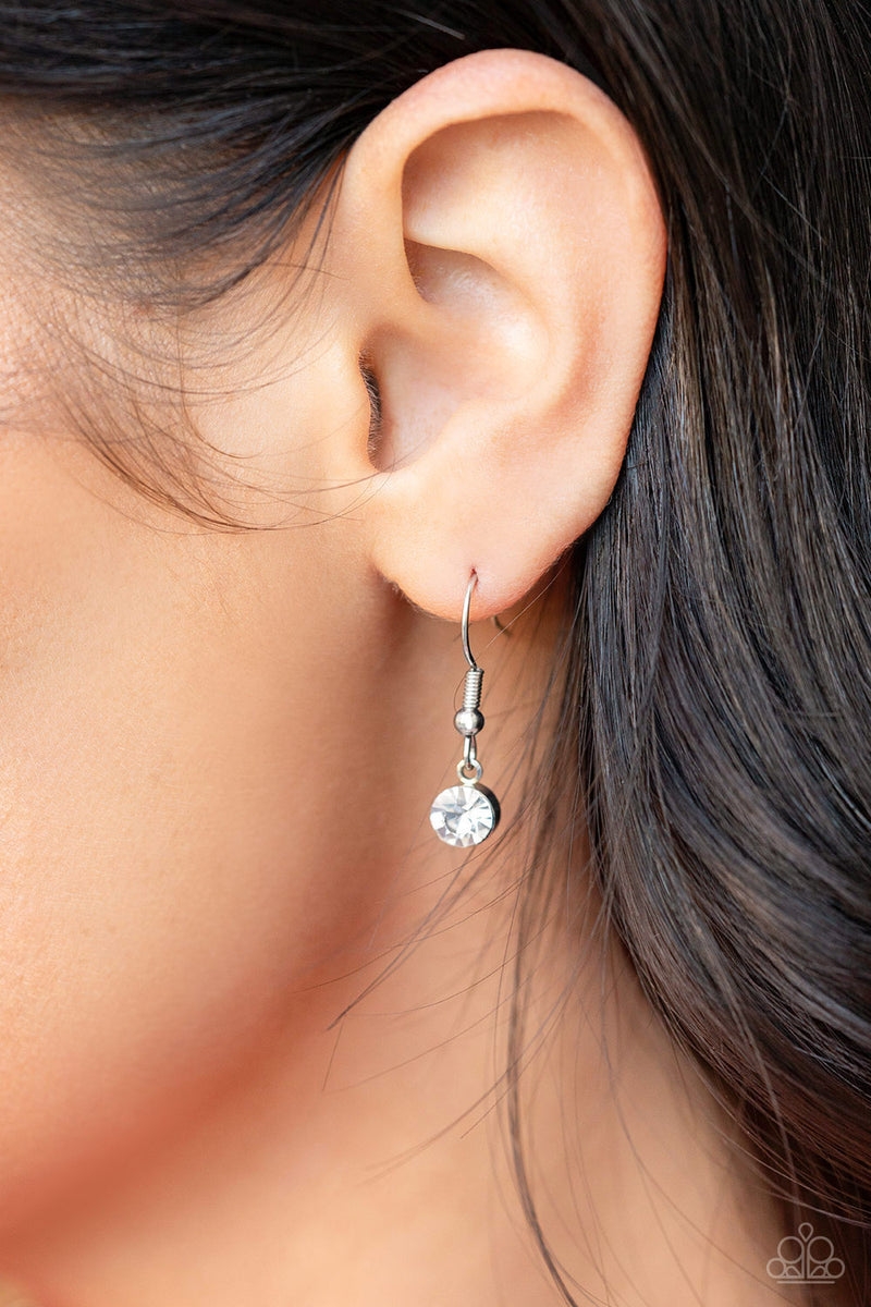 Heartbreakingly Blingy White Necklace - Paparazzi Accessories  A dramatically oversized silver heart frame is encrusted in row after row of dazzling white rhinestones, resulting in heart-racing sparkle below the collar. Features an adjustable clasp closure.  Sold as one individual necklace. Includes one pair of matching earrings.  #P2RE-WTXX-585XX