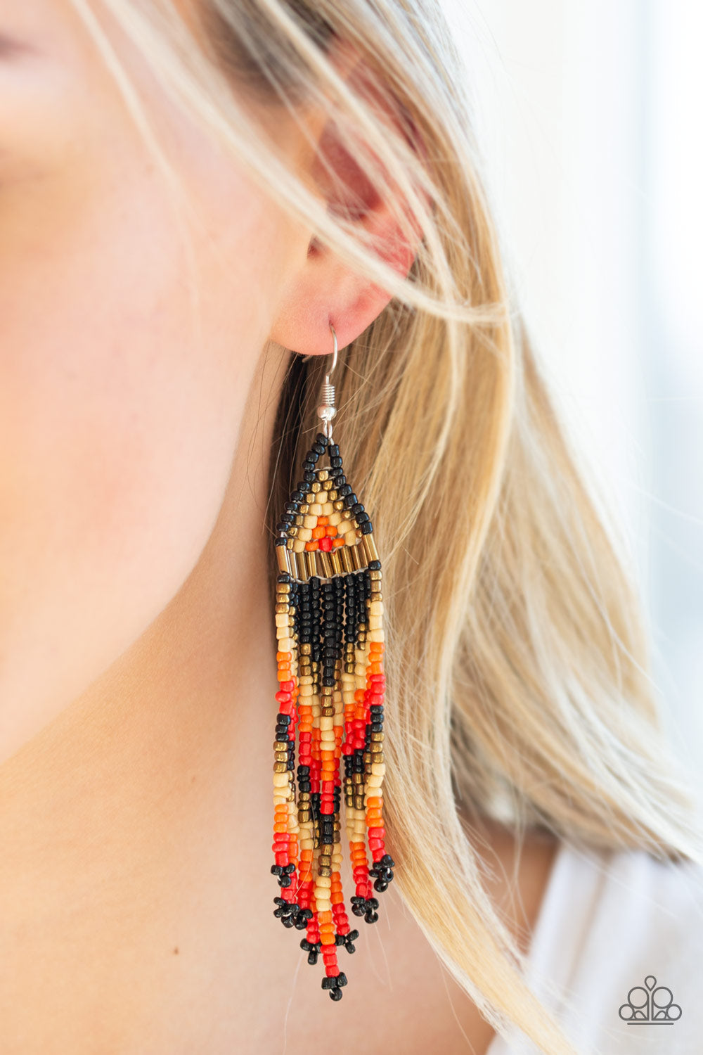 Colors Of The Wind Black Seed Bead Earring - Paparazzi Accessories  Item #P5TR-BKXX-093XX Infused with brassy metallic accents, black, orange, red, tan, and brass seed beads cascade from the ear in a vivacious beaded fringe. Earring attaches to a standard fishhook fitting.  Sold as one pair of earrings.