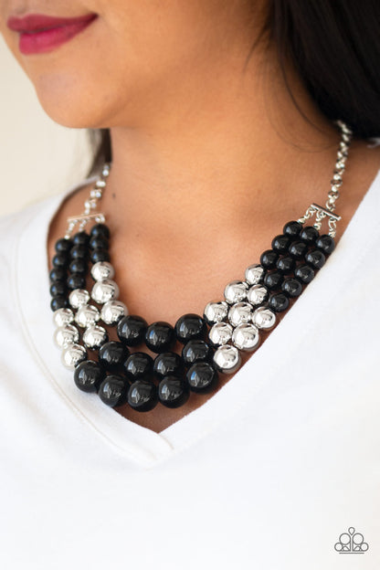 Dream Pop Black Necklace - Paparazzi Accessories  Item #P2ST-BKXX-068XX Gradually increasing in size near the center, a collection of black and silver beads layer below the collar in a statement making fashion. Features an adjustable clasp closure.  Sold as one individual necklace. Includes one pair of matching earrings.