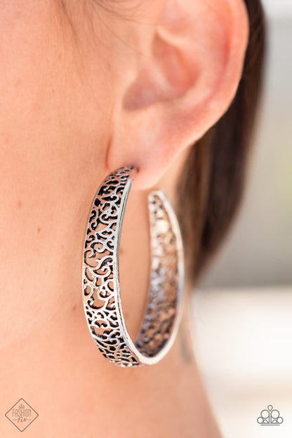 Garden for Two Silver Hoop Earring - Paparazzi Accessories  Item #P5HO-SVXX-301DZ Whimsical swirls of antiqued silver filigree flow wildly within simple silver frames to create an intricate hoop. Earring attaches to a standard post fitting. Hoop measures approximately 2" in diameter.  Sold as one pair of hoop earrings.