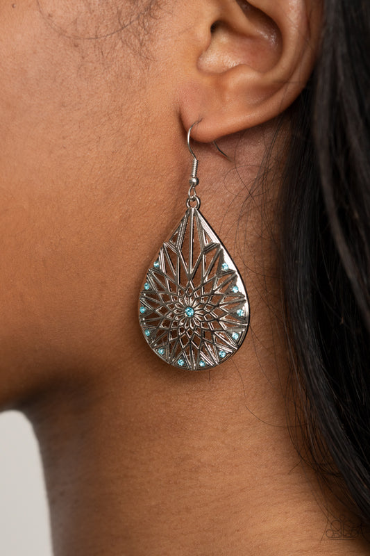 Icy Mosaic Blue Earring - Paparazzi Accessories  Item #P5RE-BLXX-219XX Featuring a shattered snowflake pattern, the front of an airy silver teardrop is adorned in dainty blue rhinestones for an icy finish. Earring attaches to a standard fishhook fitting.  Sold as one pair of earrings.